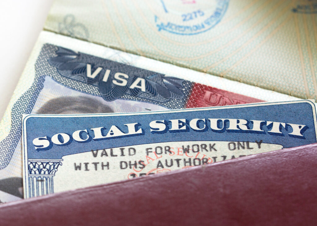 American Visa and Social Security Card with '"Valid for work only with DHS authorisation"'