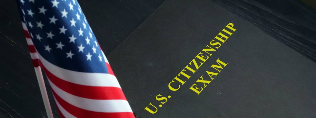 US citizenship exam test and USA flag.