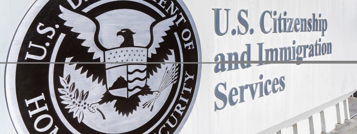 The U.S. Citizenship and Immigration Services sign outside of the main office.